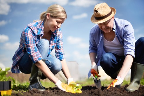 Gardening crew preparing tools and van for a removal job