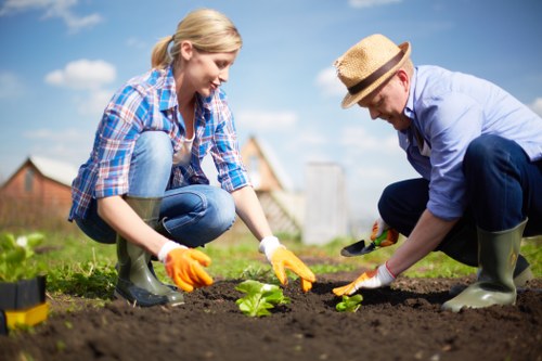 Operator using PPE while applying garden treatment